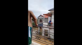 Residents throw food to neighbours after floods submerge streets in Vietnam