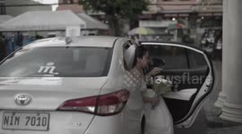 Wedding planner leaps over bride's dress to save her from falling display board