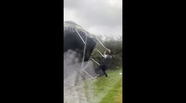 Man rescues trampoline during storm in Bute, Scotland, UK