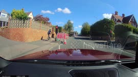 Cyclist gets instant karma after running red light - straight into path of car