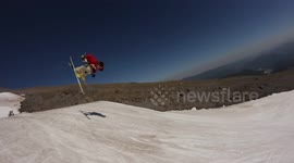 Skier attempts a double flip and has a hard landing