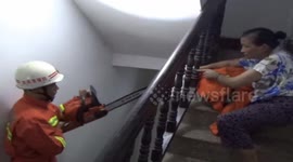 Drunk man stuck his head in handrail on stair