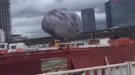 Giant moon balloon rolls across Chinese city during typhoon