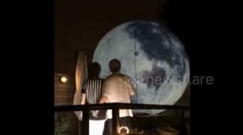 Romantic grandpa prepares a giant moon balloon for his wife on Mid-autumn Festival