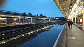Newbury train station in the UK 'underwater' following rain storm