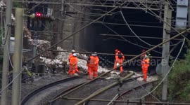 Engineers inspect damage after landslide derails train near Watford Junction