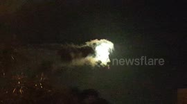 Moon being eaten by 'flying dragon' cloud