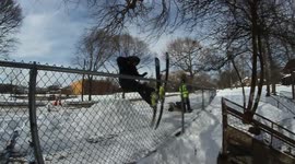Man skis straight into fence