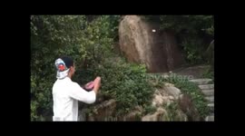 Kung-fu practitioner opens cans by throwing playing cards at them