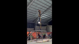 Fallen acrobat makes come back with a pose before slamming face on metal frame