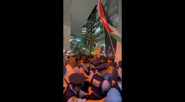 Police contain protesters outside Israeli Embassy in Tokyo, Japan