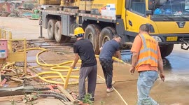 Men struggle to control high-pressure Venturi tube in Sichuan, China