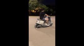 Siberian Husky rides a scooter in Hubei, China