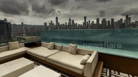 View of the amazing chongqing city skyline from a luxury terrace with infinity pool
