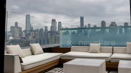 View of the amazing chongqing city skyline from a luxury terrace with infinity pool