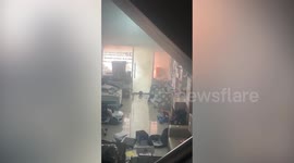 Electric car bursts into flames while charging outside office