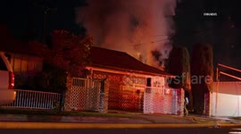 US, Los Angeles: San Fernando Car Fire Spreads Embers To Brush And Threatens Home