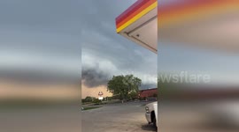 Ominous shelf cloud looms above gas station in Michigan