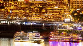 View of the amazing hongadong cave lit up at night  with the chongqing skyline in the background from a unique high vantage point