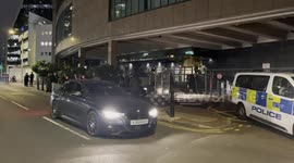 A Protester Standing By The Britannia International Hotel Complains That Has Been Hit By A Car Entering The Premises
