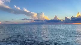 Golden sunset glow over the ocean in Venice Beach, Florida, USA