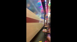 Terrifying moment train ploughs into tables on Hanoi's viral 'train street' sending tourists ducking