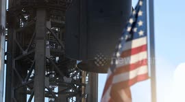 (Image 6) Flags wave at Starbase as the Starship is stacked onto Booster 15.2 prior to Flight 11
