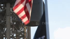 (Image 7) Flags wave at Starbase as the Starship is stacked onto Booster 15.2 prior to Flight 11