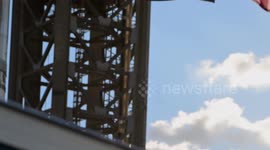 (Image 8) Flags wave at Starbase as the Starship is stacked onto Booster 15.2 prior to Flight 11