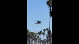 Helicopter crashes near beach in Huntington Beach, California, USA