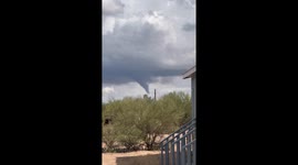 Rare funnel cloud forms over Sierrita Mountains near Tucson, Arizona