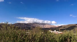 Clouds over Mount Hermon, Majdal Shams left, Druze Nabi Yaafuri mosque Mas'ade right. Timelapse.