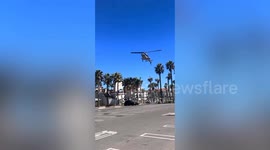 Moment helicopter spirals out of control and crashes into trees