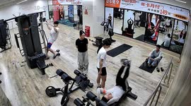 Woman accidentally tumbles onto man during workout in Yunnan, China