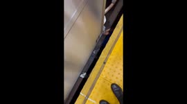 Intoxicated man rescued after falling between train cars in New York, USA