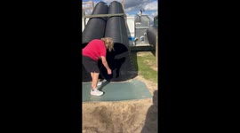 Little girl’s first slide ends in the sand in Louisiana, USA