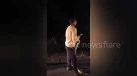 Drivers catch huge python seen slithering across road in India