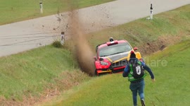 Rally car crashes into ditch before almost hitting spectator running to rescue in Austria