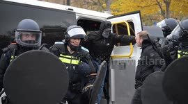 Police arrest protesters during anti-immigration march in Amsterdam