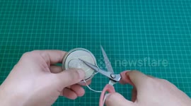 Crafts enthusiast makes drinking mugs from beer cans