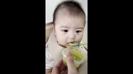 Baby unimpressed with first taste of avocado