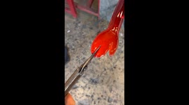 Artist Blows Glass Bag Holding Itself