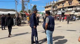 Palestinian security forces manage traffic on Salah al-Din Street as Gazans return home