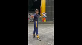 Acrobat leaps onto running horse to wave flag in circus rehearsal
