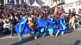 Indian dancers in blue practice dance steps at DIWALI on The Square 2025 to one two three four - London