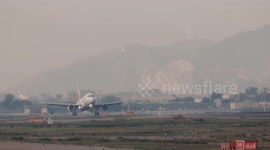 An airplane coming into land at barcelona airport in spain