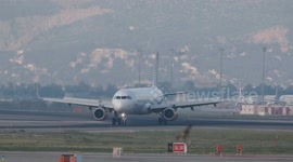 A Vueling airplane on the runway barcelona airport in spain