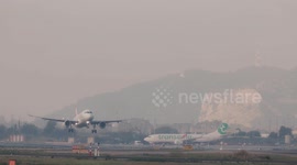 An airplane coming into land at barcelona airport in spain