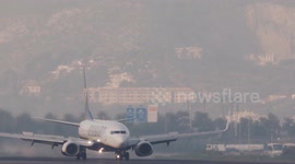 A Ryanair airplane taxiing after landing at the terminal of barcelona airport in spain