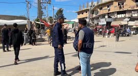 Palestinian security forces manage traffic on Salah al-Din Street as Gazans return home
